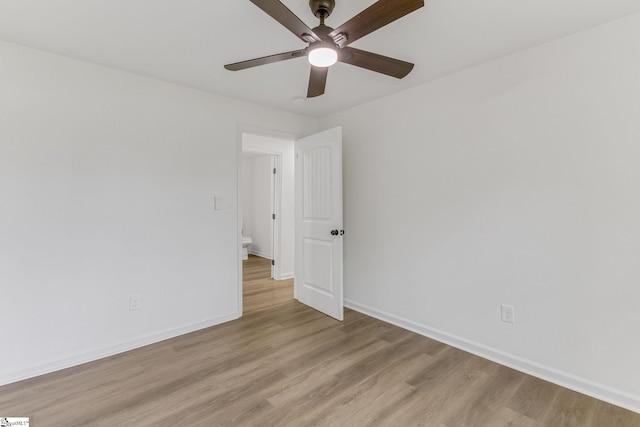 empty room featuring ceiling fan and light hardwood / wood-style floors