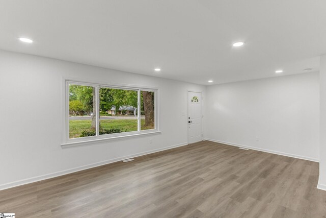 spare room featuring hardwood / wood-style flooring