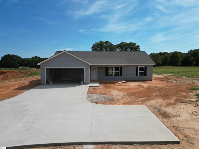 single story home featuring a garage