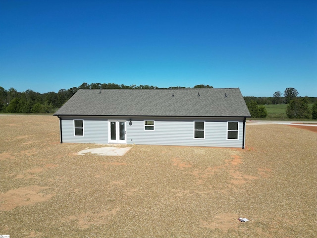 back of property featuring french doors