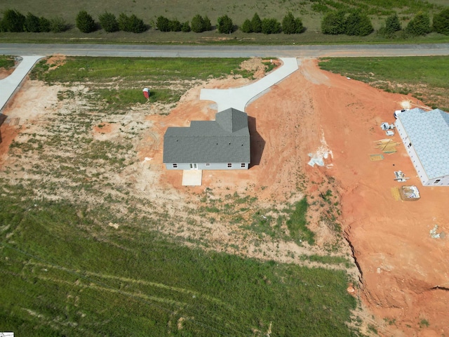 birds eye view of property featuring a rural view