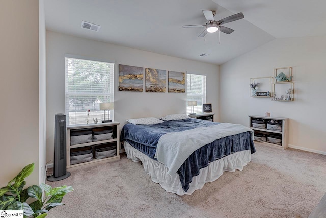 carpeted bedroom featuring multiple windows, lofted ceiling, and ceiling fan