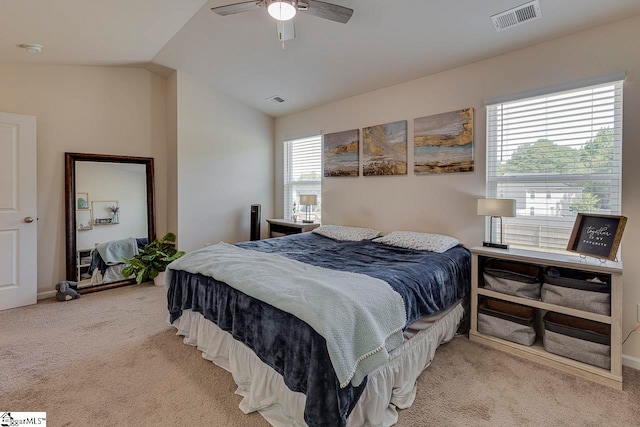 carpeted bedroom featuring lofted ceiling and ceiling fan