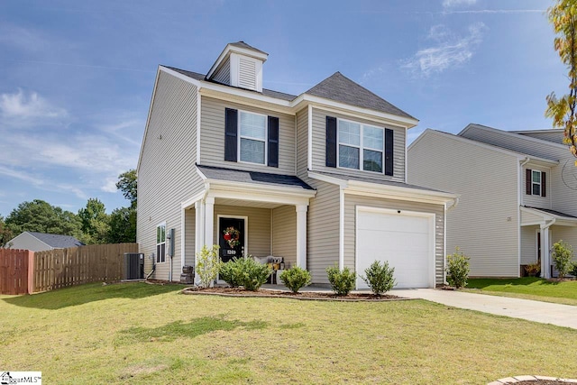 view of front of property featuring a garage, a front yard, and central air condition unit