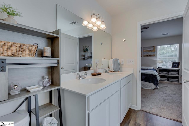 bathroom featuring vanity and hardwood / wood-style flooring