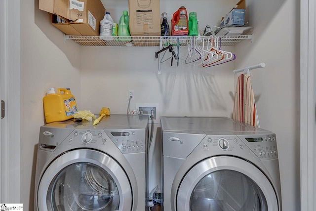 laundry room featuring washing machine and clothes dryer