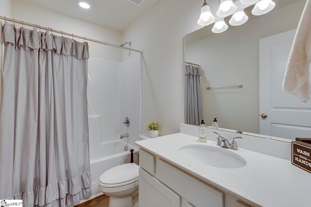 full bathroom with vanity, toilet, shower / tub combo with curtain, and hardwood / wood-style flooring