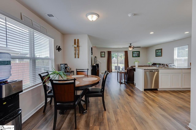 dining space featuring hardwood / wood-style floors and ceiling fan