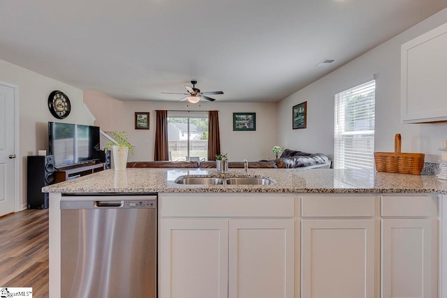 kitchen featuring light hardwood / wood-style flooring, ceiling fan, plenty of natural light, and stainless steel dishwasher