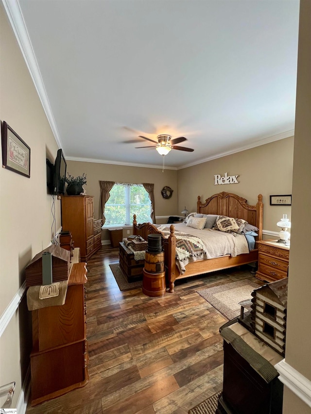 bedroom featuring ceiling fan, dark hardwood / wood-style flooring, and ornamental molding