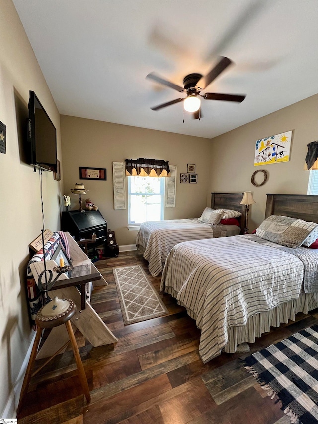 bedroom featuring ceiling fan and dark hardwood / wood-style floors