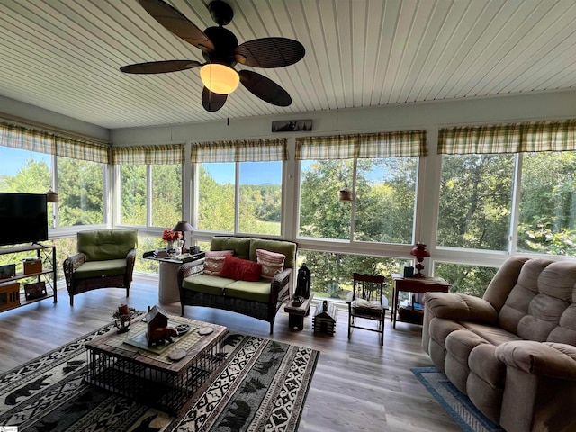 sunroom featuring ceiling fan