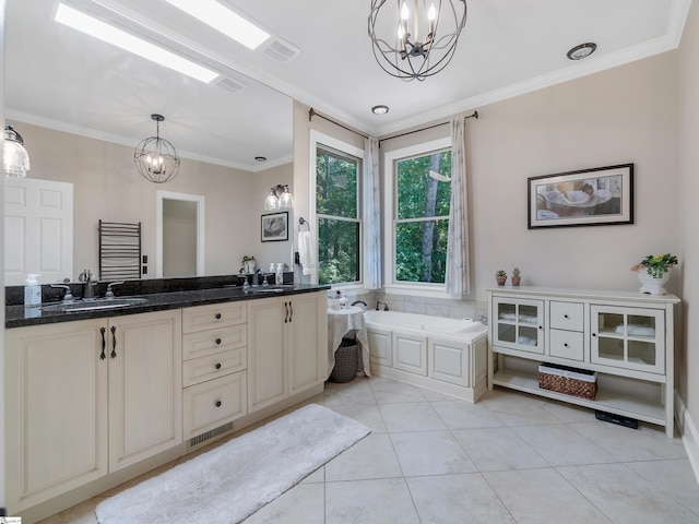 bathroom with vanity, an inviting chandelier, tile patterned flooring, crown molding, and a bathtub