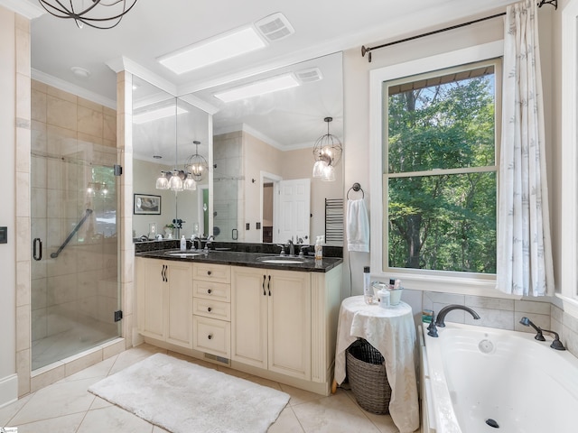 bathroom with tile patterned flooring, crown molding, vanity, independent shower and bath, and an inviting chandelier