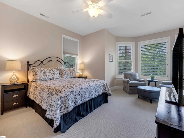 bedroom with light colored carpet and ceiling fan