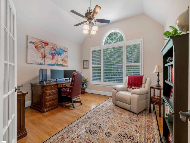 office space featuring light wood-type flooring, french doors, lofted ceiling, and ceiling fan