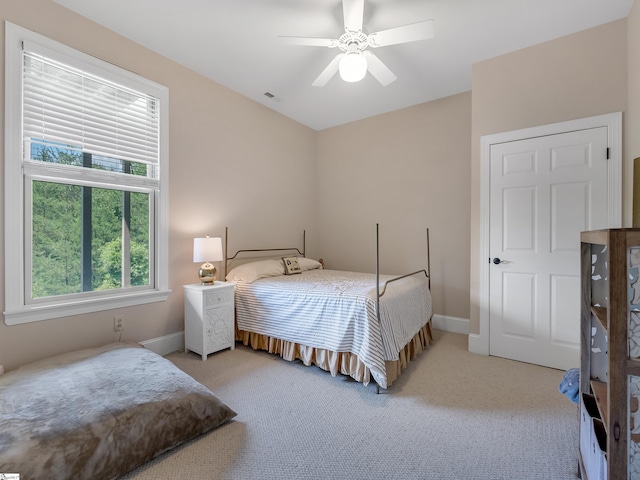 carpeted bedroom featuring ceiling fan