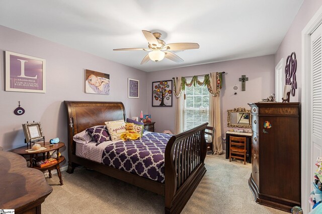 bedroom featuring carpet, ceiling fan, and a closet