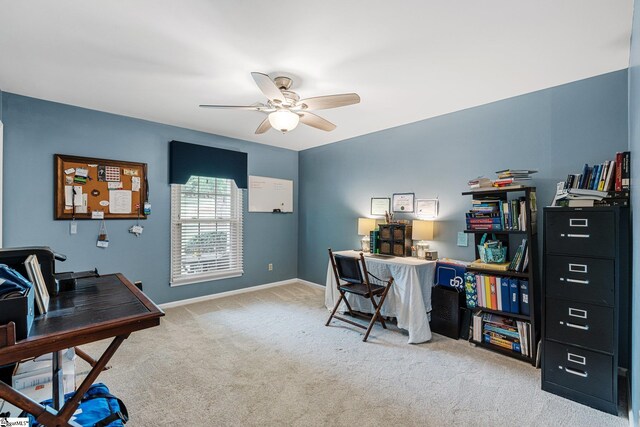 home office with ceiling fan and light colored carpet