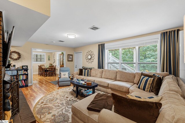 living room with light hardwood / wood-style flooring