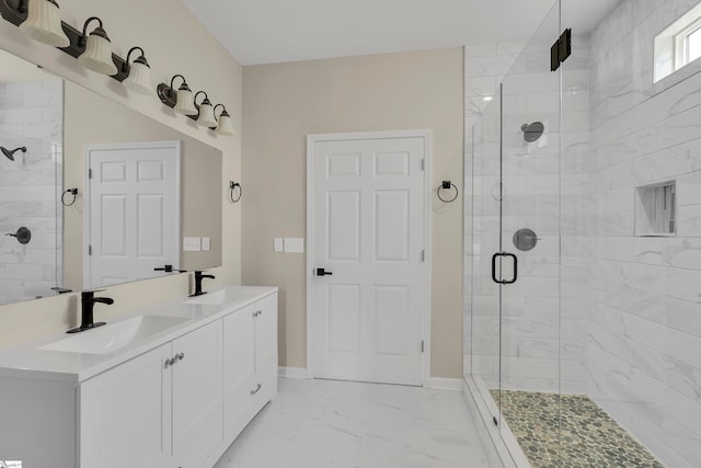 bathroom featuring vanity and a shower with shower door