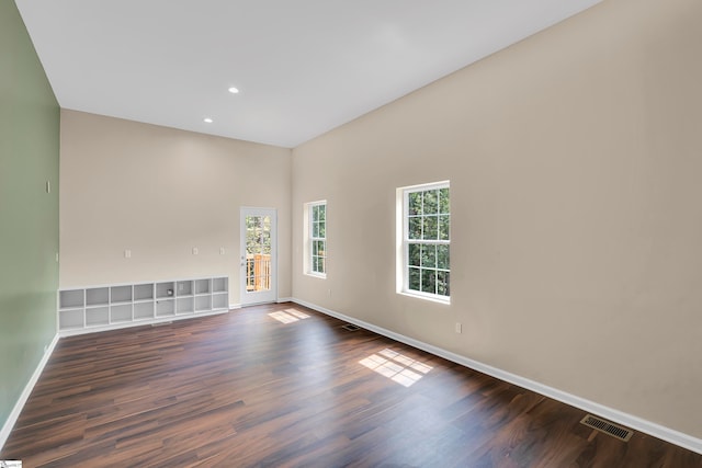 spare room featuring dark hardwood / wood-style flooring