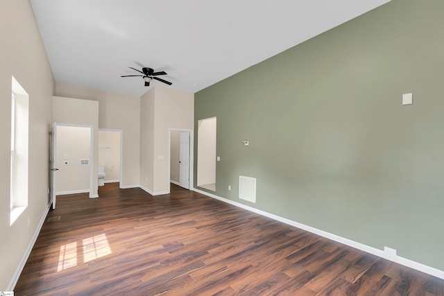 unfurnished bedroom with dark hardwood / wood-style flooring and ceiling fan