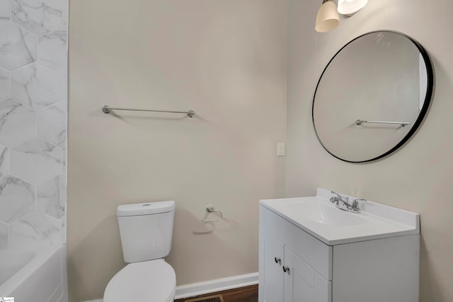 full bathroom featuring toilet, bathing tub / shower combination, and vanity