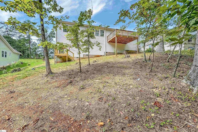 view of yard featuring a wooden deck