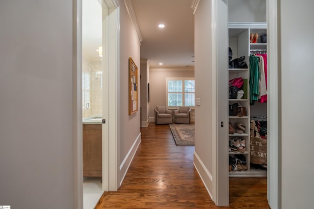 hallway featuring hardwood / wood-style flooring and crown molding