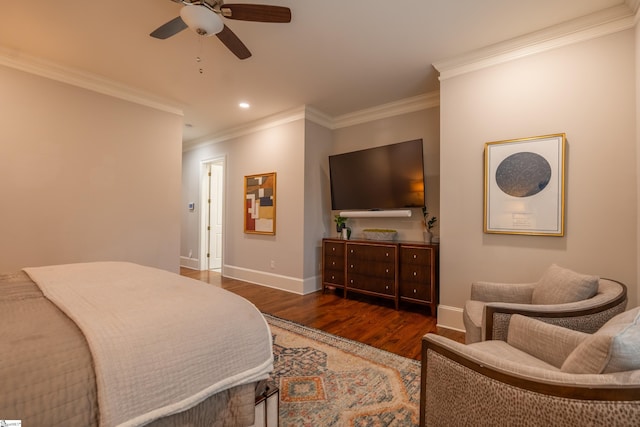 bedroom with crown molding, ceiling fan, and dark hardwood / wood-style floors