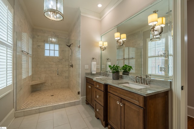 bathroom featuring a shower with door, vanity, an inviting chandelier, tile patterned flooring, and ornamental molding