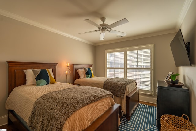 bedroom featuring ceiling fan, ornamental molding, and dark hardwood / wood-style flooring