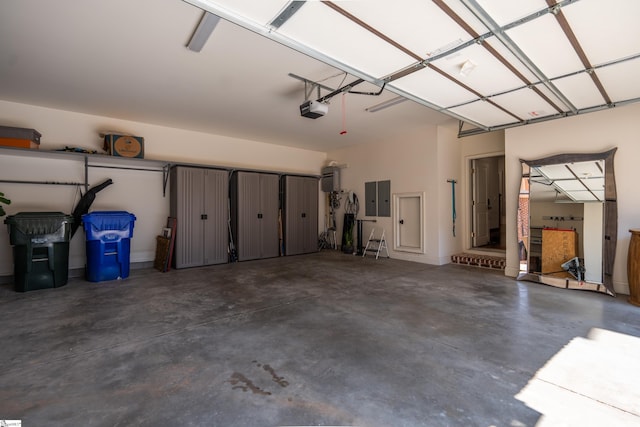 garage featuring a garage door opener and electric panel