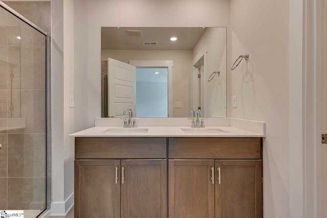 bathroom with vanity and walk in shower