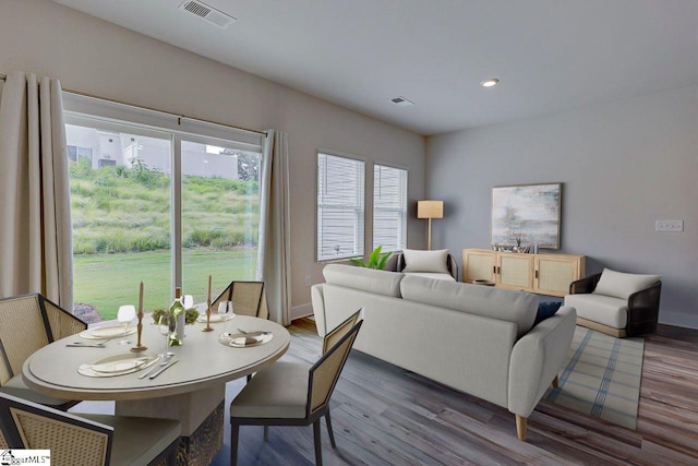 dining room with hardwood / wood-style flooring