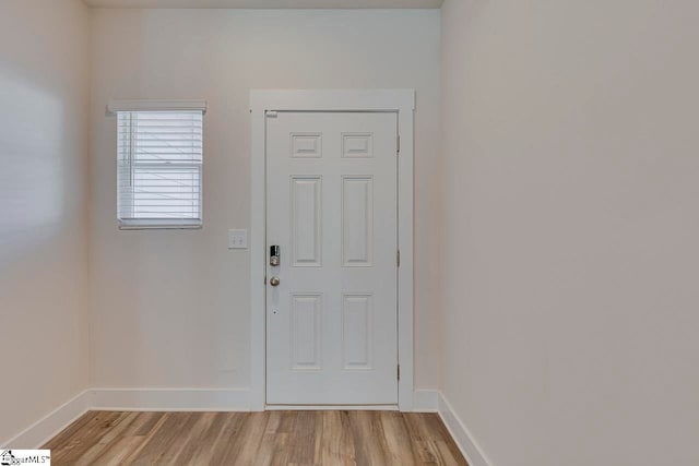 doorway to outside with light hardwood / wood-style flooring