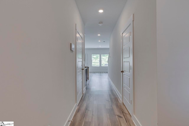 corridor with light wood-type flooring