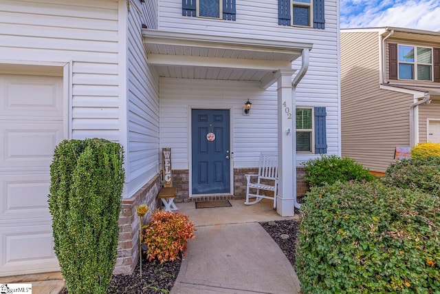 property entrance with a garage