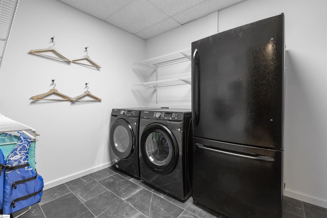 clothes washing area featuring washer and dryer