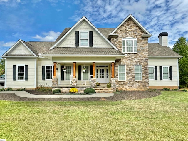 craftsman inspired home with a porch and a front lawn