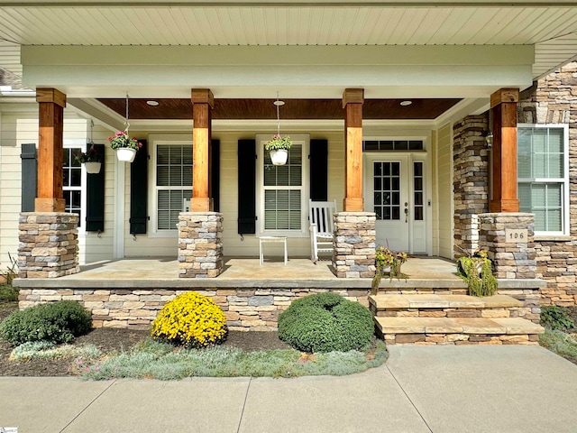 doorway to property featuring covered porch