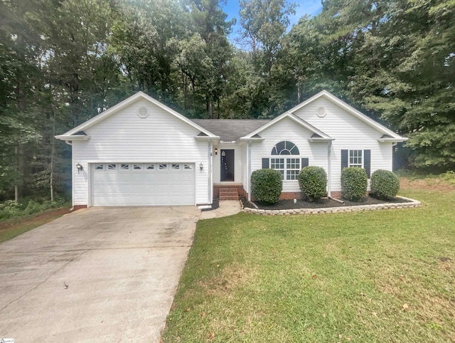 single story home featuring a garage and a front yard