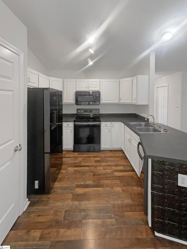 kitchen featuring dark wood-type flooring, stainless steel appliances, white cabinetry, and sink