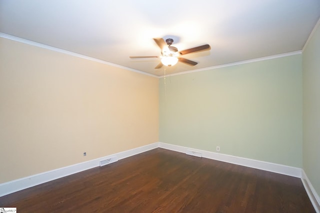 spare room with ceiling fan, ornamental molding, and dark hardwood / wood-style flooring