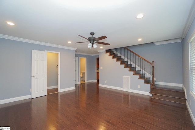 unfurnished living room with ornamental molding, dark wood-type flooring, a wealth of natural light, and ceiling fan