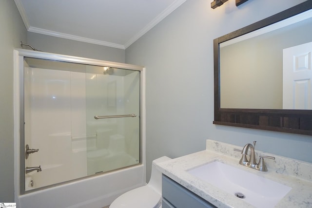 full bathroom featuring enclosed tub / shower combo, toilet, crown molding, and vanity