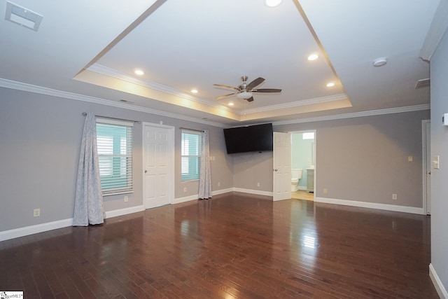 unfurnished living room with crown molding, a raised ceiling, ceiling fan, and dark hardwood / wood-style floors