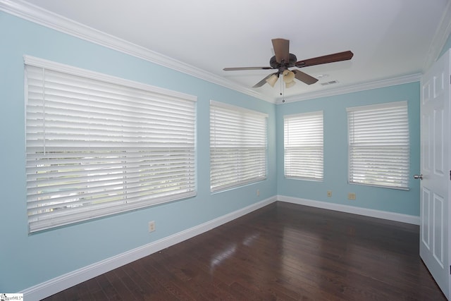 empty room with ceiling fan, dark hardwood / wood-style flooring, and ornamental molding