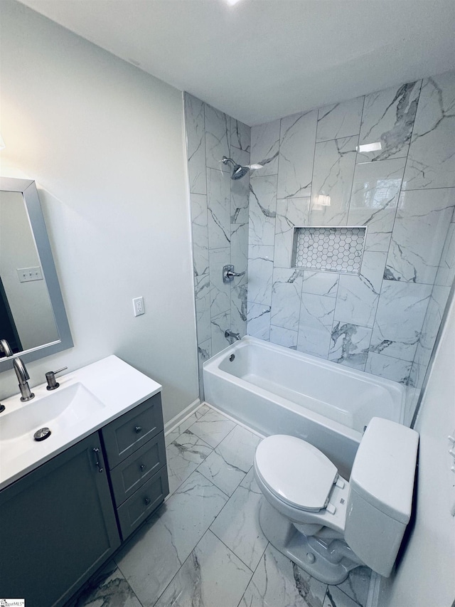 full bathroom featuring tiled shower / bath combo, toilet, and vanity